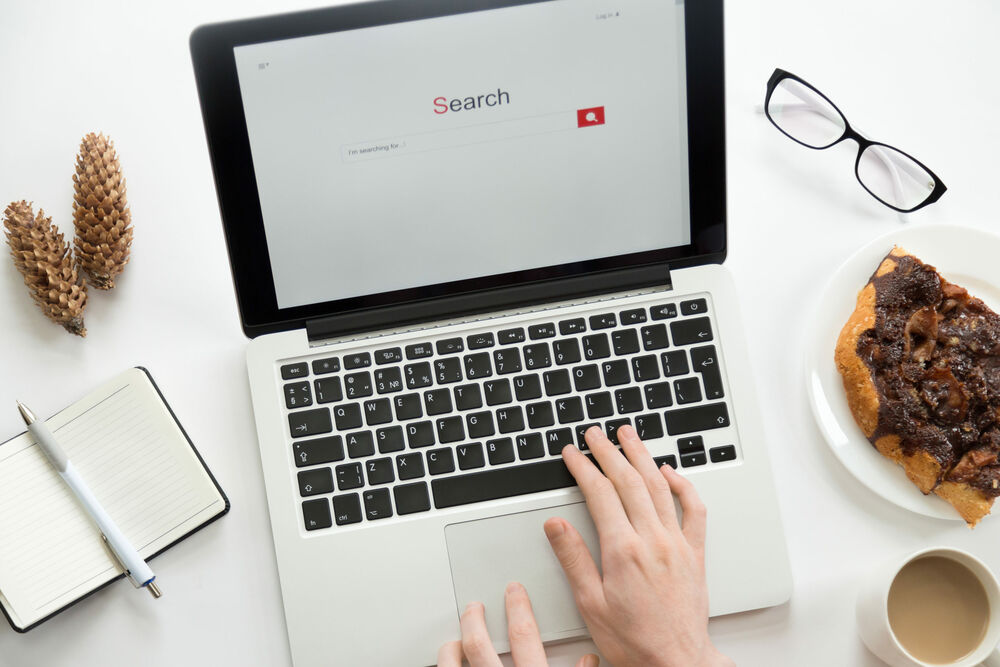 hands opening a search result page